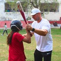 Young students playing baseball 