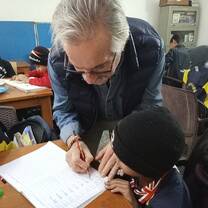 Teacher helping student