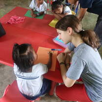US students teach Panamanian students in the classroom.