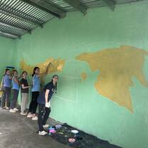 Painting a map of the world.