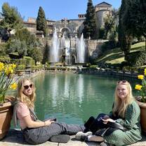 Women sitting at fountain