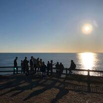 Students looking over the sea