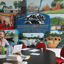 a student at a table at the program center 