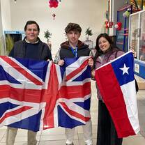 Students holding Chile and England flags