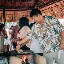 Students learning to make homemade corn tortillas in western Belize.