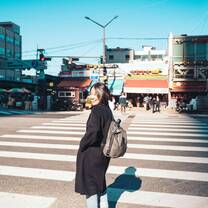 Student posing in crosswalk