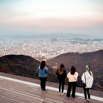 Four students overlooking beautiful city