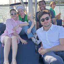 Students enjoying themselves on a sailboat in Lisbon, Portugal