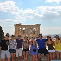 Many students smiling in front of the Parthenon