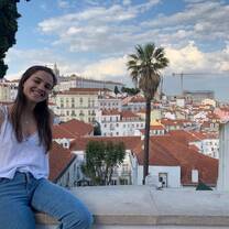 Student sits overlooking beautiful town in Portugal