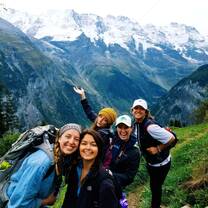 Students posing in front of beautiful mountains