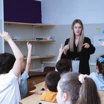 Meddeas Language Assistant with her students