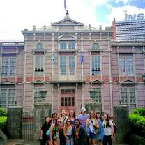 Students posing in front of a graduate school building