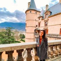 Student posing on a ledge of a building in France