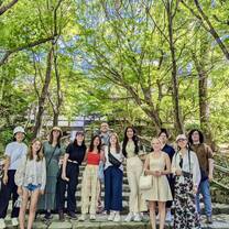group smiling in the trees