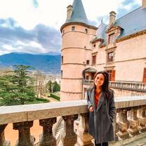 Student posing on a ledge of a building in France