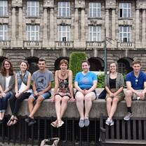 Students sit and pose for a picture in Prague