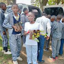 children receiving tree seedlings