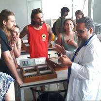 Learning about tropical insects at the biology lab of a local university