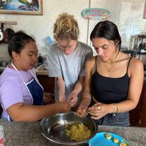 Volunteers in cooking class learning how to make traditional Balinese food