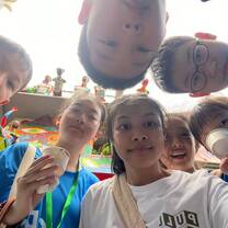 Camp Cosmos students taking an up close group photo