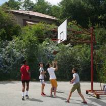 Four campers playing a baskeball game