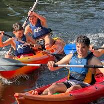 Group of campers having fun in their canoes 