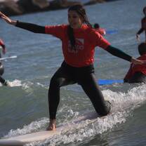 A camper surfing in one of Galicia's top surfing beaches
