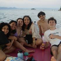 CET Brazil students on a boat together in Paraty, Brazil
