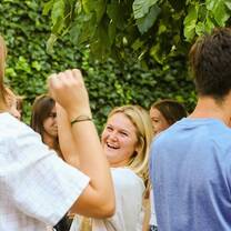 LITA students holding hands, dancing, and laughing during an improv workshop
