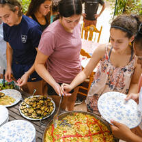 LITA students sharing a meal of traditional Fideuá