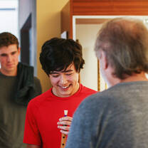 LITA student learning about how a Gaita, or bagpipes, works. Shown learning how to play the double reed mouthpiece