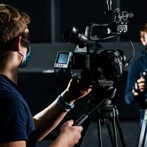 Students using a TV camera in studio