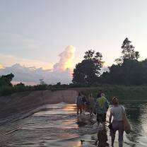 Volunteers crossing the water