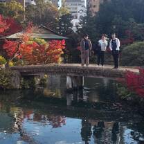 Students exploring Japanese garden and learning history / culture 