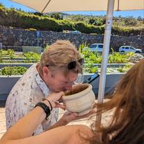 Man smelling a planter