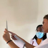 Volunteers looking at a paper
