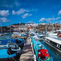 Colourful boats by the harbourside_CREDIT: Dan Rowley