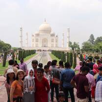 Volunteers from around the world visiting The Taj Mahal, the monument of love while participating in our Volunteer & Travel Program where they cover 10+ cities across India while participating in action-orientated impactful volunteering activities along with cultural immersion through travel to historic monuments, participating in art & food related workshops and much more