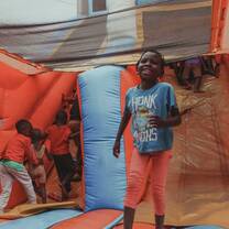 Young children jumping on a bouncing castle