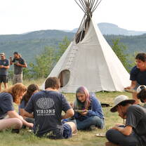 VISIONS Montana Blackfeet participants painting hides 