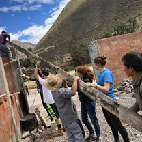 VISIONS Peru participants helping at the project.