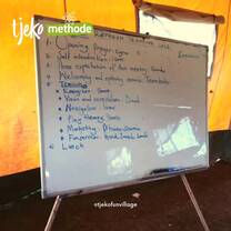 Whiteboard with agenda written on it 