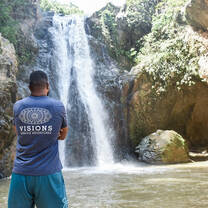 VISIONS Dominican Republic leader observing waterfall 