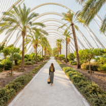 A woman walks in the park