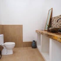Our toilets, the mirror has since been placed on the wall and paintings added