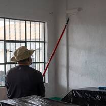 volunteer painting the school
