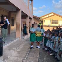 Volunteer addressing children