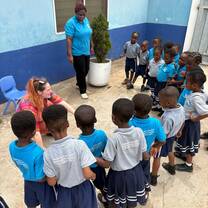 Volunteer addressing children