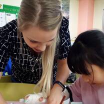 Teacher helping student